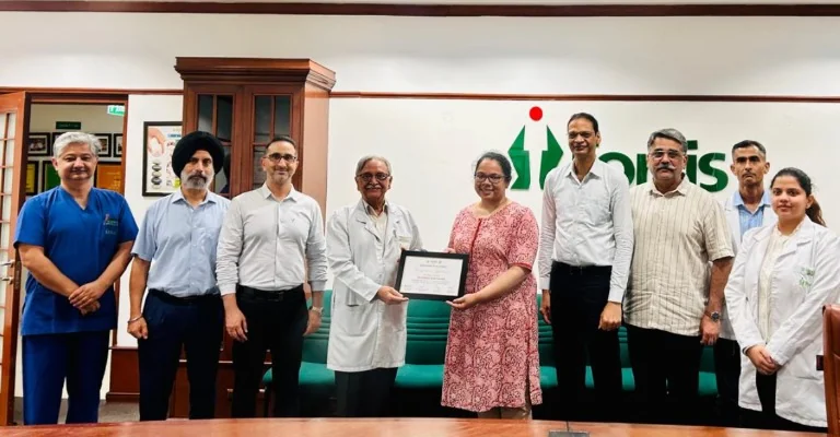 Dr. Suranjana Basak receiving a recognition plaque from senior colleagues at Fortis Hospital, Mohali